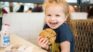 A girl eating a cookie