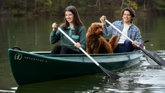 Couple and Dog in a Canoe 