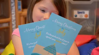 A girl with christmas cards