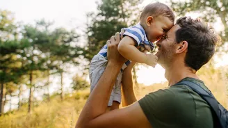 Father holding son
