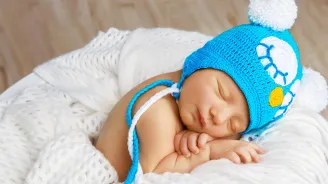 Newborn baby with blue hat