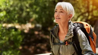 Older female backpacker out for a hike