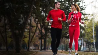 a man and woman running