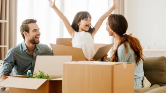 Family unpacking boxes