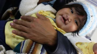 a baby being held