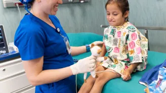 A doctor with a young female patient