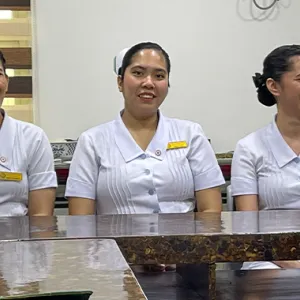 Filipino nurses sitting at a table