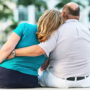 A mature couple showing their love outdoors