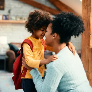 A Mother is Nose to Nose with Her Daughter Just as She's About to Leave For School