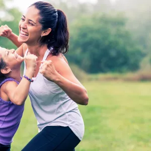 A mother and daughter get active together.