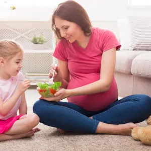 A mom to be eating healthy. 