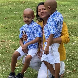 Marelyn Salgado hugs her twin sons, Aaron and Ryan, near AdventHealth for Children.