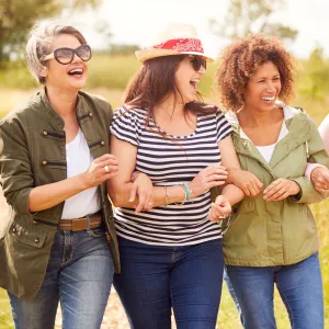 Woman walking and laughing outdoors