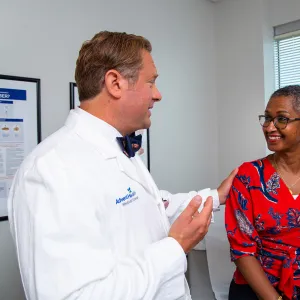 Allen Chudzinski Talking with patient at an appointment.