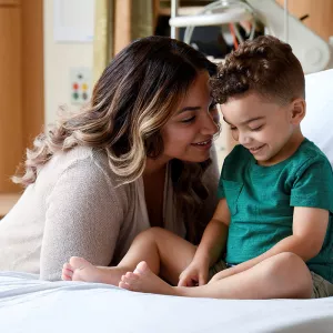 adventhealth for children day of giving, child patient in bed with mother