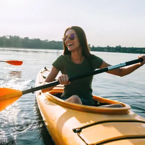 Couple kayaking outdoors together.