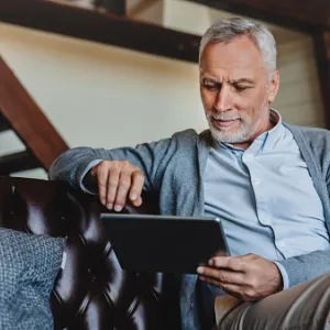 man reading tablet