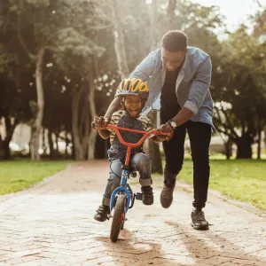 Man and son ride bike