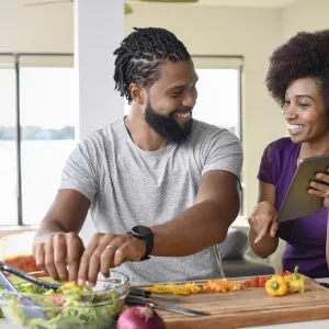 A couple trying a new, healthy recipe. 