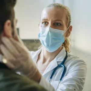 Female physician with patient