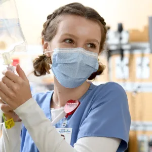 An AdventHealth team member starts an IV.