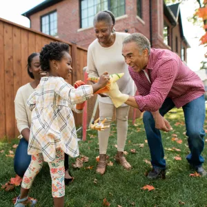 Grandparents engaging with their granddaughter, happily