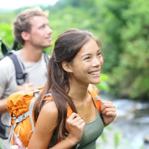 A happy couple hiking.