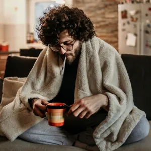 A young man sick at home