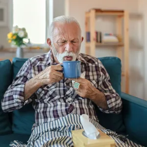 A man drinking tea.