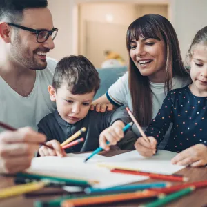 mom and dad playing with kids at home