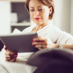 Older Female Reading on Couch