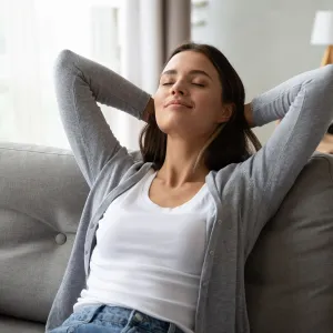 An adult woman rests at home