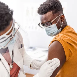 A patient getting cleaned up after a shot