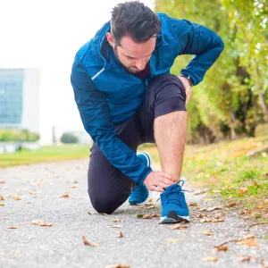 A runner kneeling down.