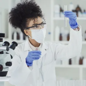 A woman conducting a lab test.