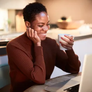 A woman reading on her computer.