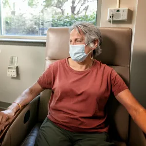 A woman getting infusion therapy.