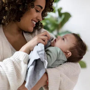 A woman holding her infant.