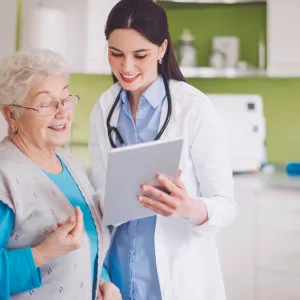 A woman reviews her test results with her doctor.