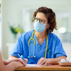 A woman visiting her health care provider. 