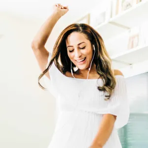 Woman listening to music with headphones on