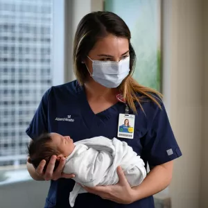 Nurse holding baby