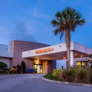 A photo of the AdventHealth Lake Wales facility at dusk.