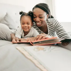 Woman Reading with daughter.