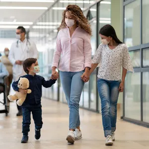 Mother, son and daughter leaving the emergency room.