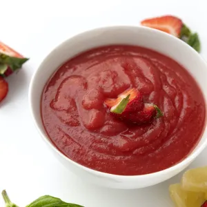 Bowl of strawberry sauce topping