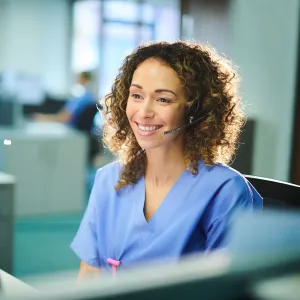 Nurse on phone call at computer