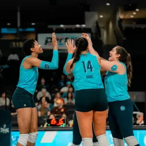 Orlando Valkyries team members hi-five