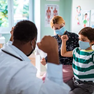 A doctor having a connecting moment with a child patient