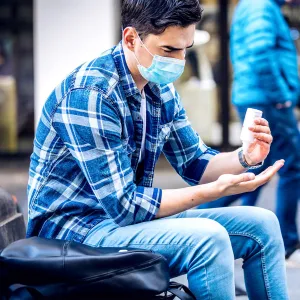 Person using hand sanitizer.